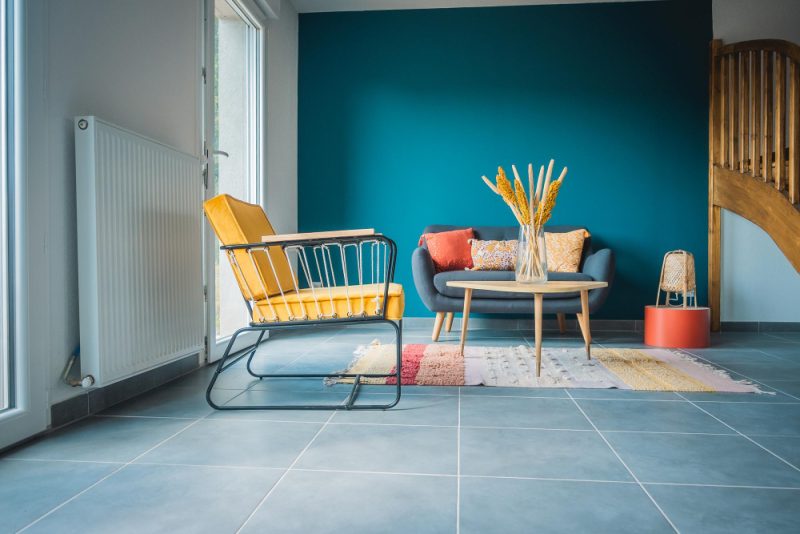 yellow armchair in blue living room