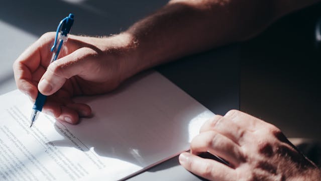 person-signing-documentation