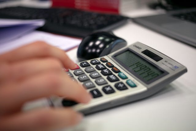 person-using calculator