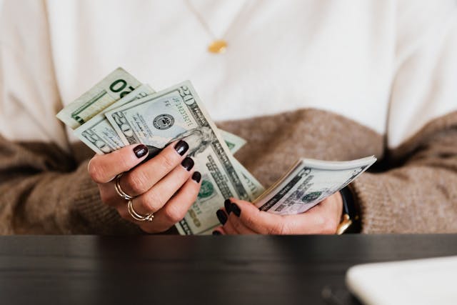 person-counting-money-bills